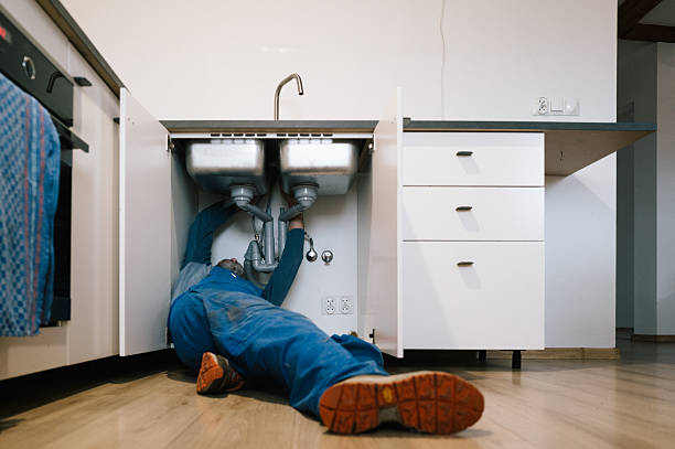 Professional Emergency Plumber technician working in Marshfield, MA